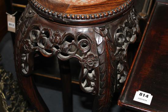 A Chinese carved hongmu vase stand, with rouge marble inset top, Diam. of top 28cm, overall W.34cm H.91cm